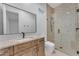 Modern bathroom featuring stylish vanity, granite countertop, and glass enclosed shower at 38024 N 15Th Ave, Phoenix, AZ 85086