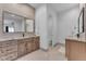 Elegant bathroom with double sinks, wood cabinets, granite counters, and walk-in shower at 38024 N 15Th Ave, Phoenix, AZ 85086