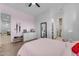 Spacious bedroom featuring wood floors, a ceiling fan and an ensuite bath at 38024 N 15Th Ave, Phoenix, AZ 85086