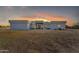 Modern home featuring a desert landscape and a striking sunset view at 38024 N 15Th Ave, Phoenix, AZ 85086