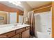 Well-lit bathroom featuring a single sink vanity and shower-tub combo with modern fixtures at 3967 E Hematite Ln, San Tan Valley, AZ 85143