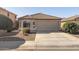 Charming single-story home with a tile roof, desert landscaping, and a two-car garage at 3967 E Hematite Ln, San Tan Valley, AZ 85143