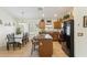 Bright kitchen and dining area with a center island, black appliances, and tile flooring at 3967 E Hematite Ln, San Tan Valley, AZ 85143