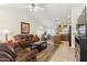 Open-concept living room with a ceiling fan, tile flooring, and easy access to the kitchen at 3967 E Hematite Ln, San Tan Valley, AZ 85143