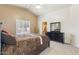 Spacious bedroom with a vaulted ceiling, carpet flooring, and access to an en-suite bathroom at 3967 E Hematite Ln, San Tan Valley, AZ 85143