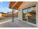 Covered back patio area featuring a sliding glass door, perfect for outdoor living and entertaining at 4165 W Park Ave, Chandler, AZ 85226