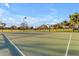 Community outdoor basketball court surrounded by grass and mature trees at 4165 W Park Ave, Chandler, AZ 85226