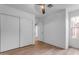 Bedroom featuring wood flooring and a closet with sliding doors at 4165 W Park Ave, Chandler, AZ 85226