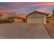 Single-story home featuring a private driveway and mature desert landscaping at 4165 W Park Ave, Chandler, AZ 85226