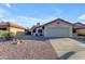 Single-story home featuring a tile roof, front-facing garage, and desert landscaping at 4165 W Park Ave, Chandler, AZ 85226