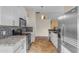 Open kitchen design featuring stainless steel appliances, granite countertops, and subway tile backsplash at 4165 W Park Ave, Chandler, AZ 85226