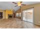 Open floorplan with tile floors, sliding glass door, and a traditional fireplace at 4165 W Park Ave, Chandler, AZ 85226