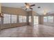 Inviting living room with tile floors, large windows, and vaulted ceiling with ceiling fan at 4165 W Park Ave, Chandler, AZ 85226