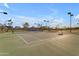 Outdoor tennis courts with lighting for evening games on a sunny day at 4165 W Park Ave, Chandler, AZ 85226