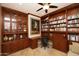 Elegant home office with custom built-in bookshelves, desk space, and ample storage for a productive workspace at 4251 E Desert Forest Trl, Cave Creek, AZ 85331