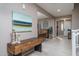 Inviting entryway with stylish console table, artwork, and views into the dining room at 43805 N Ericson Ln, New River, AZ 85087