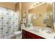 Bathroom with a combination shower and tub, cherry vanity and sink at 4546 E Sierra Sunset Trl, Cave Creek, AZ 85331