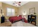 Cozy bedroom featuring a ceiling fan, window with shutters, and neutral paint at 4546 E Sierra Sunset Trl, Cave Creek, AZ 85331