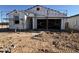 Exterior view of a house in the construction phase showing the initial framing and structure at 47463 W Kenner Dr, Maricopa, AZ 85139