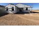 A daytime, exterior view of a house under construction with a large, open backyard at 47463 W Kenner Dr, Maricopa, AZ 85139