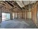 Interior view of a home under construction with visible framing, insulation, and a sliding glass door at 47463 W Kenner Dr, Maricopa, AZ 85139