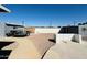 Expansive backyard featuring gravel ground cover, a concrete walkway, and block wall fencing at 4836 W Redfield Rd, Glendale, AZ 85306