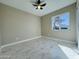 Bedroom with window, ceiling fan, and marble-effect floor at 4836 W Redfield Rd, Glendale, AZ 85306