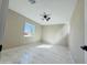 Bedroom showcasing marble-effect flooring, window, and a ceiling fan at 4836 W Redfield Rd, Glendale, AZ 85306