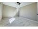 Bedroom with ceiling fan, marble-effect floor, and lots of light at 4836 W Redfield Rd, Glendale, AZ 85306