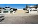 Charming home showcasing a low white fence and desert landscaping for low maintenance appeal at 4836 W Redfield Rd, Glendale, AZ 85306