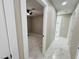 Hallway featuring new marble floors leading to an open bedroom at 4836 W Redfield Rd, Glendale, AZ 85306