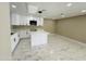 Modern kitchen featuring white cabinets, marble floors, and sleek pendant lighting over the island at 4836 W Redfield Rd, Glendale, AZ 85306