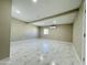 Large living room with modern marble floors and recessed lighting for a spacious atmosphere at 4836 W Redfield Rd, Glendale, AZ 85306