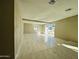 Bright living room with marble floors and sliding glass doors to the backyard at 4836 W Redfield Rd, Glendale, AZ 85306