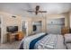 This bright bedroom features a ceiling fan, closet, and an en-suite bathroom, providing convenience and comfort at 485 S Pino Cir, Apache Junction, AZ 85120