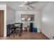 Well-lit dining area with tile flooring, a modern ceiling fan, and a large window at 485 S Pino Cir, Apache Junction, AZ 85120