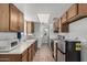 Kitchen featuring wooden cabinets, tile flooring, and stainless steel appliances at 485 S Pino Cir, Apache Junction, AZ 85120