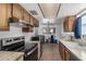 Kitchen featuring wooden cabinets and stainless steel appliances at 485 S Pino Cir, Apache Junction, AZ 85120