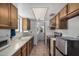 Kitchen featuring wooden cabinets, tile flooring, and stainless steel appliances at 485 S Pino Cir, Apache Junction, AZ 85120