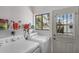 Well-lit laundry room with a washer, dryer, and a window offering natural light at 485 S Pino Cir, Apache Junction, AZ 85120