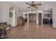 Spacious living room featuring tile floors, a ceiling fan, and views into multiple rooms at 485 S Pino Cir, Apache Junction, AZ 85120