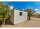 Outdoor shed with neutral corrugated walls and small window under blue sky at 485 S Pino Cir, Apache Junction, AZ 85120