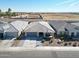 Aerial view of a home with desert landscaping, driveway, and neighboring homes in a residential area at 5121 N 181St Dr, Litchfield Park, AZ 85340