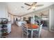 Open-concept kitchen and dining area with island seating and sliding glass doors to the patio at 5121 N 181St Dr, Litchfield Park, AZ 85340