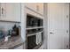 Close-up of stainless steel microwave and oven, complemented by white cabinetry at 5121 N 181St Dr, Litchfield Park, AZ 85340