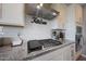 Modern kitchen featuring stainless steel appliances, granite countertops, and sleek subway tile backsplash at 5121 N 181St Dr, Litchfield Park, AZ 85340