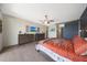 Serene main bedroom featuring a king bed, stylish decor, and tile floors at 5121 N 181St Dr, Litchfield Park, AZ 85340