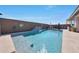 Inviting pool area with a small waterfall feature in a private backyard at 5121 N 181St Dr, Litchfield Park, AZ 85340