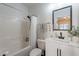 Clean bathroom featuring a shower-tub combination and a modern vanity with storage at 525 N Miller Rd # 122, Scottsdale, AZ 85257