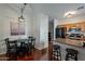 Cozy dining area with a modern chandelier, seating for four, and stylish decor at 525 N Miller Rd # 122, Scottsdale, AZ 85257